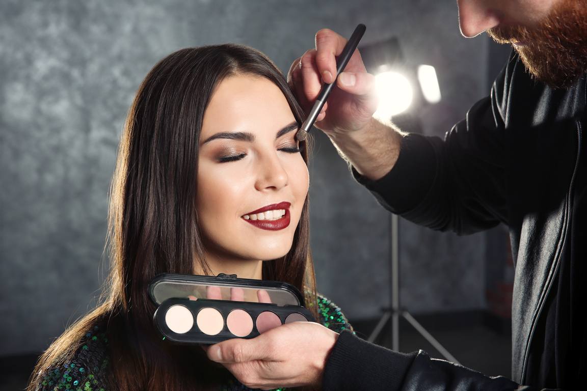 Makeup Artist Applying Makeup on Woman